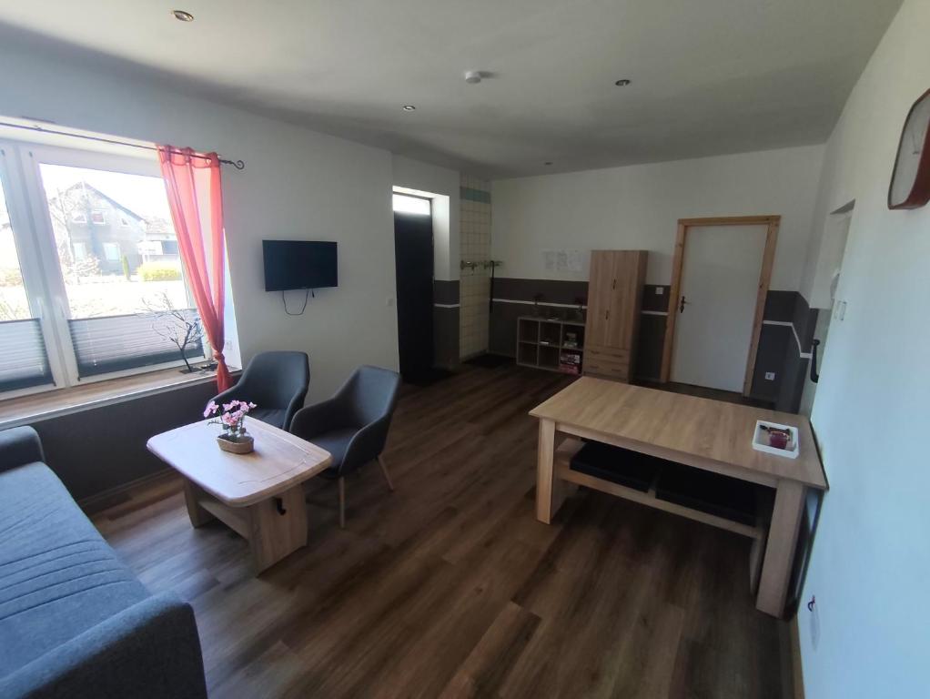 a living room with a couch and a table at Ferienwohnung Alte Fleischerei in Lauchhammer