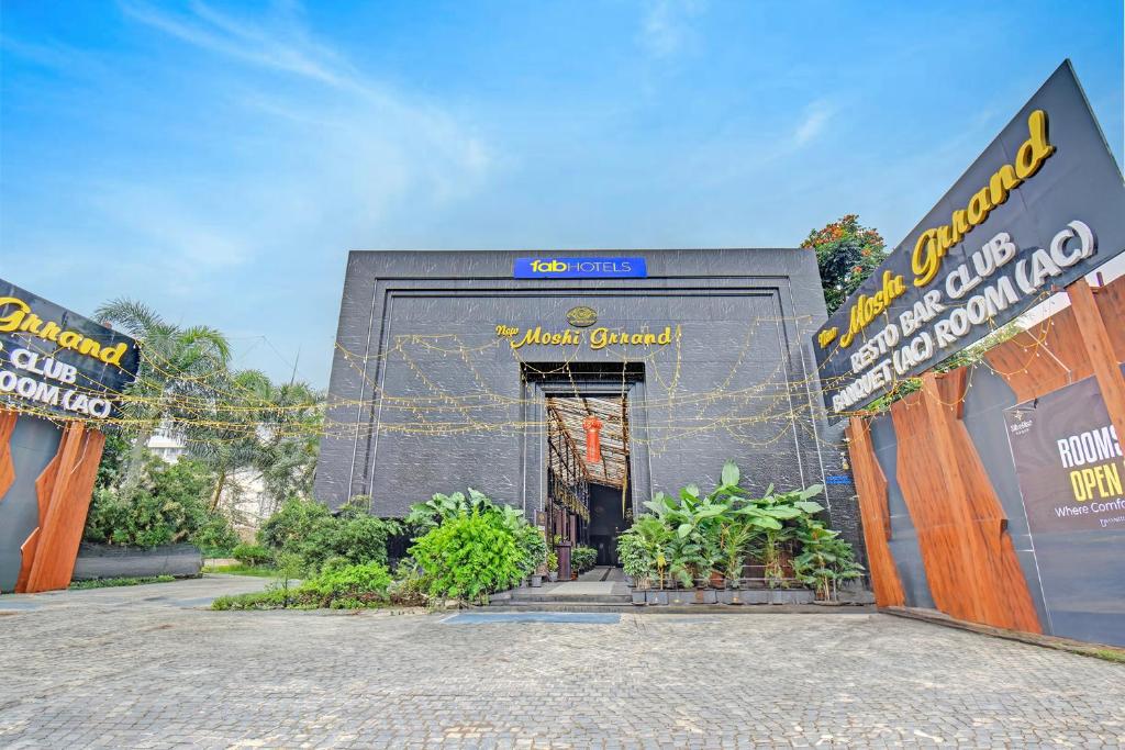 a building with a door in the middle at FabHotel New Moshi Grrand in Pune