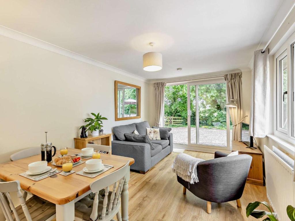 a living room with a table and a couch at 2 Bed in Crewe oc-83192 in Audlem