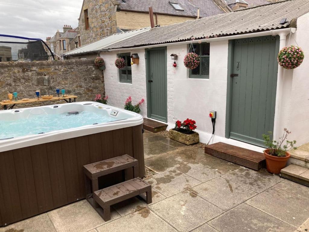a hot tub in the backyard of a house at 3 Bed in Buckie oc-89824 in Buckie