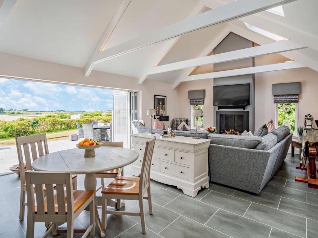 a living room with a couch and a table at 1 Bed in Glasgow oc-83392 in Eaglesham