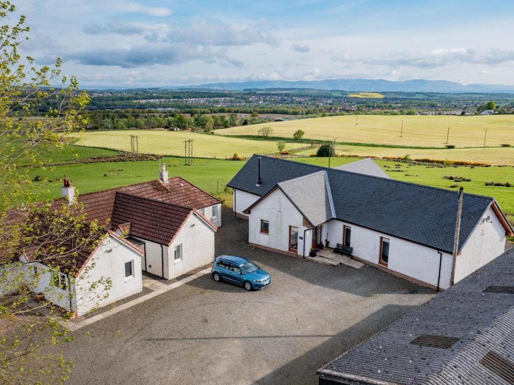 an aerial view of a house with a car parked in a driveway at 2 Bed in Bonnybridge oc-90602 in Bonnybridge