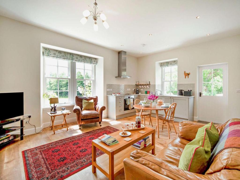 a living room with a couch and a table at 1 Bed in Hawick oc-88731 in Hawick