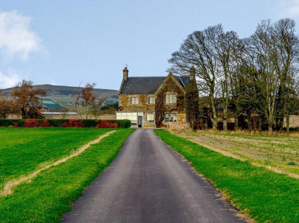 a road leading to a house in the middle of a field at 5 Bed in Anstruther oc-83504 in Pittenweem