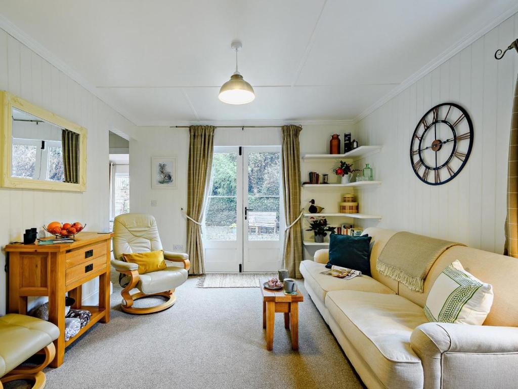 a living room with a couch and a table at 1 Bed in Maybole oc-93562 in Maybole