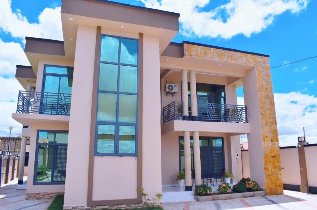 a rendering of a house with large windows at DDS Homes Apartments in Dodoma