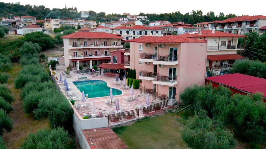an aerial view of a apartment complex with a swimming pool at Hotel Ilios in Kriopigi