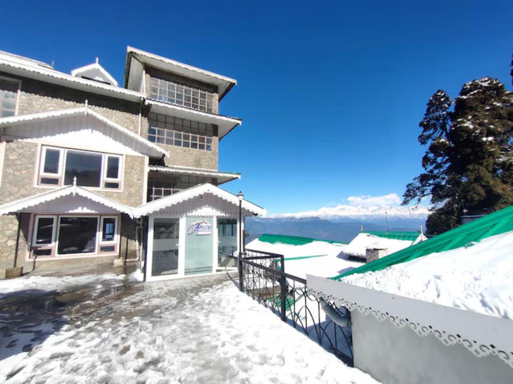 a view of a house in the snow at Anutri Hotels & Resorts in Jāmb
