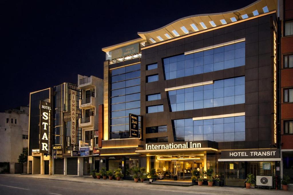 a building with a hotel on the side of a street at Hotel International Inn - Near Delhi Airport in New Delhi