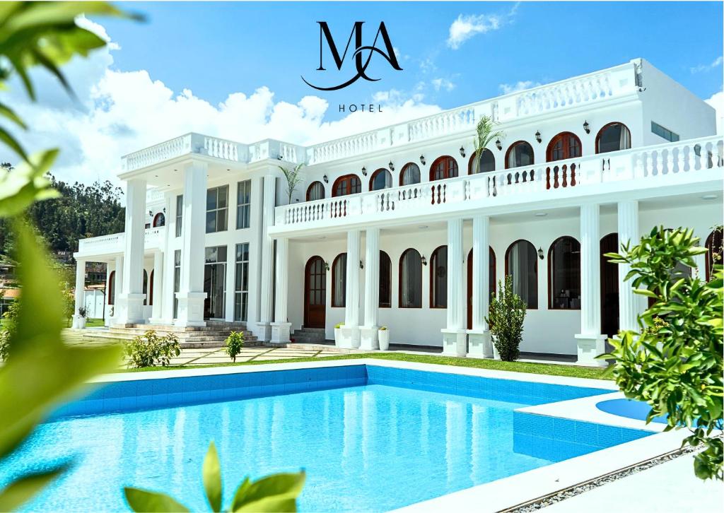 a large white mansion with a swimming pool at Mansión Altamirano - Hotel in Talavera