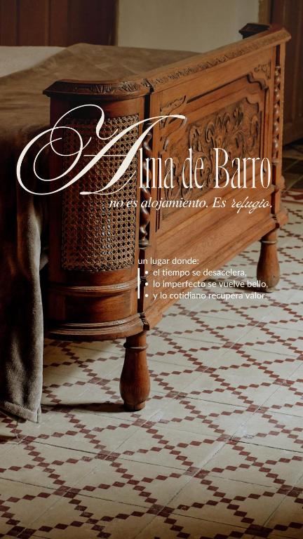 a book cover of a wooden table with a rug at Alma de Barro in El Puente del Arzobispo
