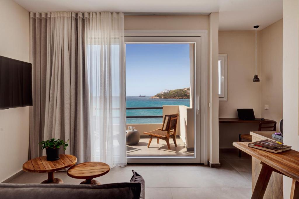 a living room with a view of the ocean at Armia Experience Hotel in Vári