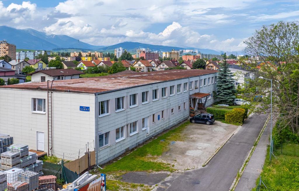 an aerial view of a building in a city at Hotel Garni in Liptovský Mikuláš