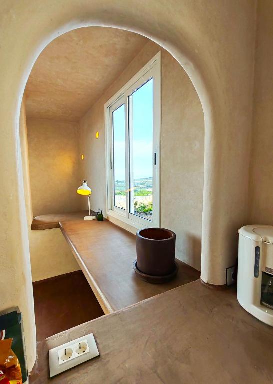 a living room with a large window and a table at local diamond in Guía de Isora