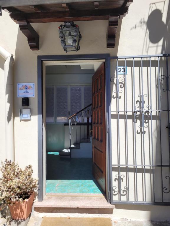 an open door to a house with a staircase at Ca' Irene in Stresa