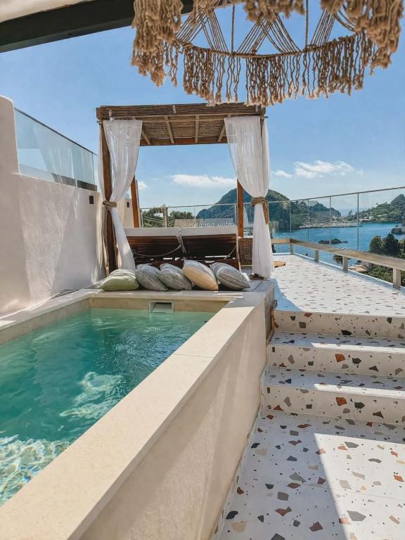 a luxury villa with a swimming pool at Tango Studios in Paleokastritsa