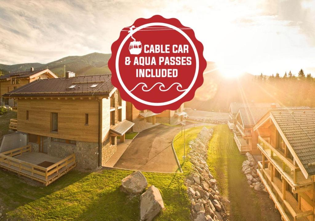 a sign for a castle cafe and aanu passes introduced at Chalets Jasná Collection - Apartments in Belá