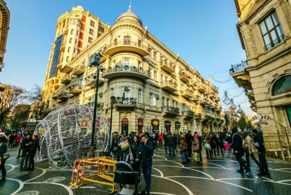 a group of people standing in front of a building at Luxury Home VIP Chaila Tower in Baku