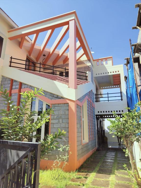a view of a house with a balcony at Serenity Villa in Mysore