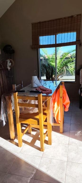 a wooden table with a laptop on top of it at House Urban in Merlo