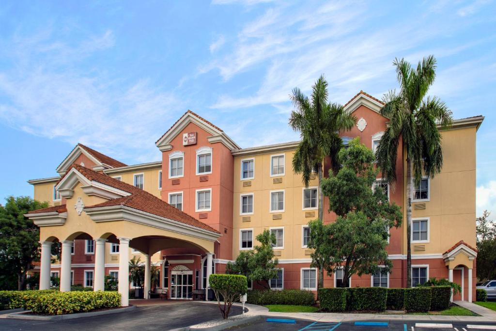 a rendering of the front of a building at Best Western Plus Miami-Doral/Dolphin Mall in Miami