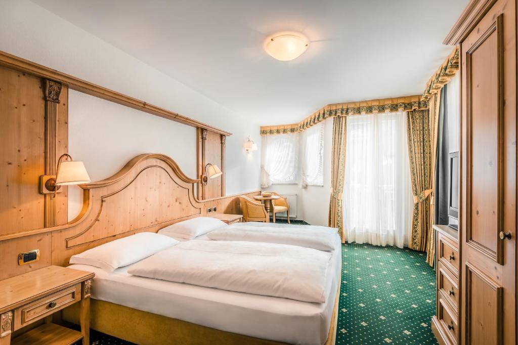 Postel nebo postele na pokoji v ubytování Hotel Maria