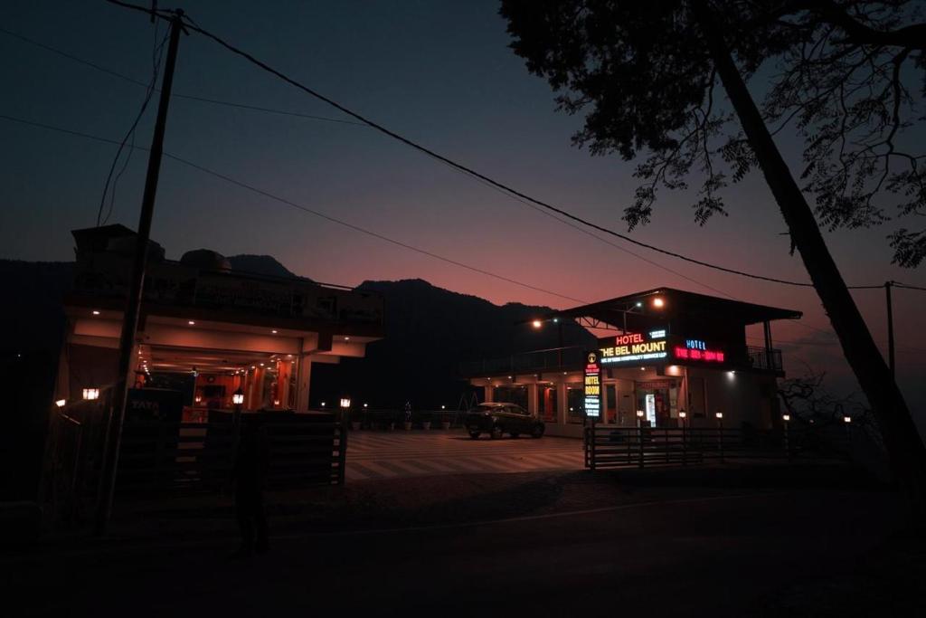 a gas station at night with the lights on at Bell Mount Mussoorie Hill view Hotel in Mussoorie
