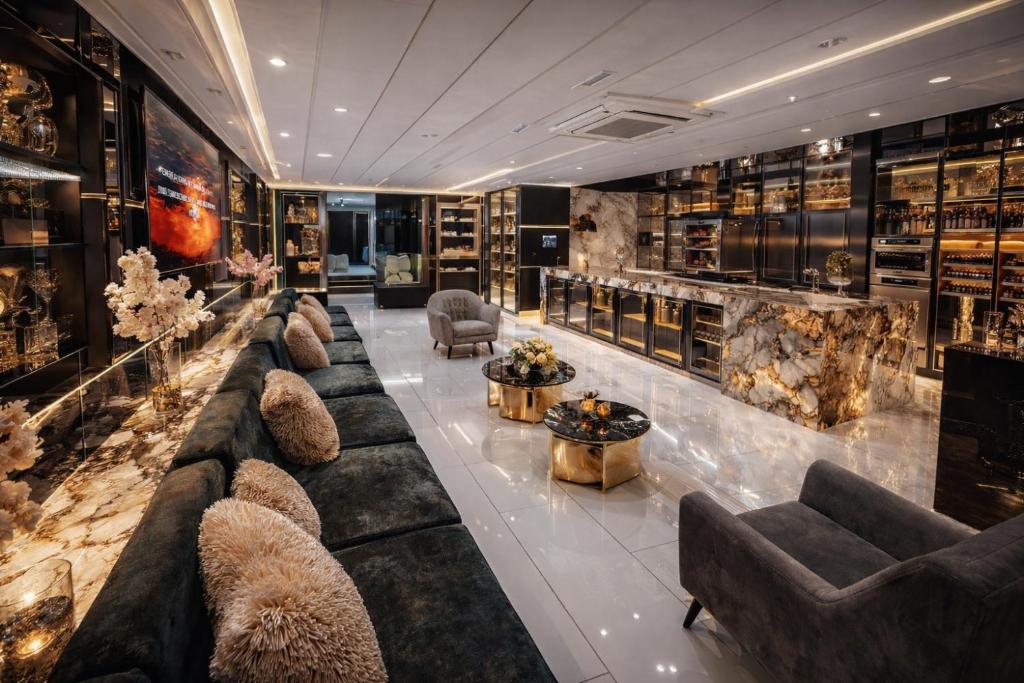a wine tasting room with couches and a lobby at 1Million Suites in Medellín