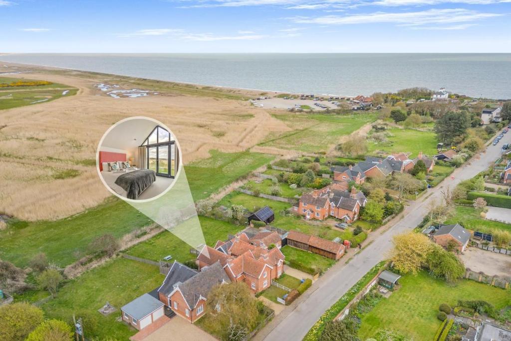 an aerial view of a house with the ocean at 3 Bed in Dunwich oc-slh in Dunwich