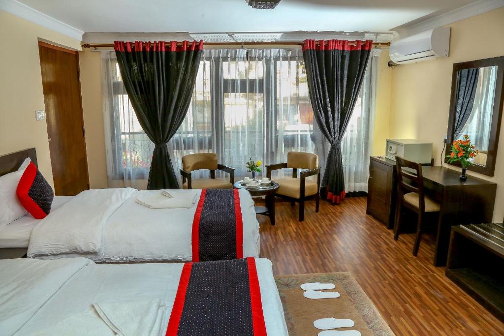 Postel nebo postele na pokoji v ubytování Taleju Boutique Hotel