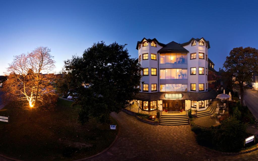 an aerial view of a large building at night at Boutiquehotel Liebesglück - adults only in Winterberg