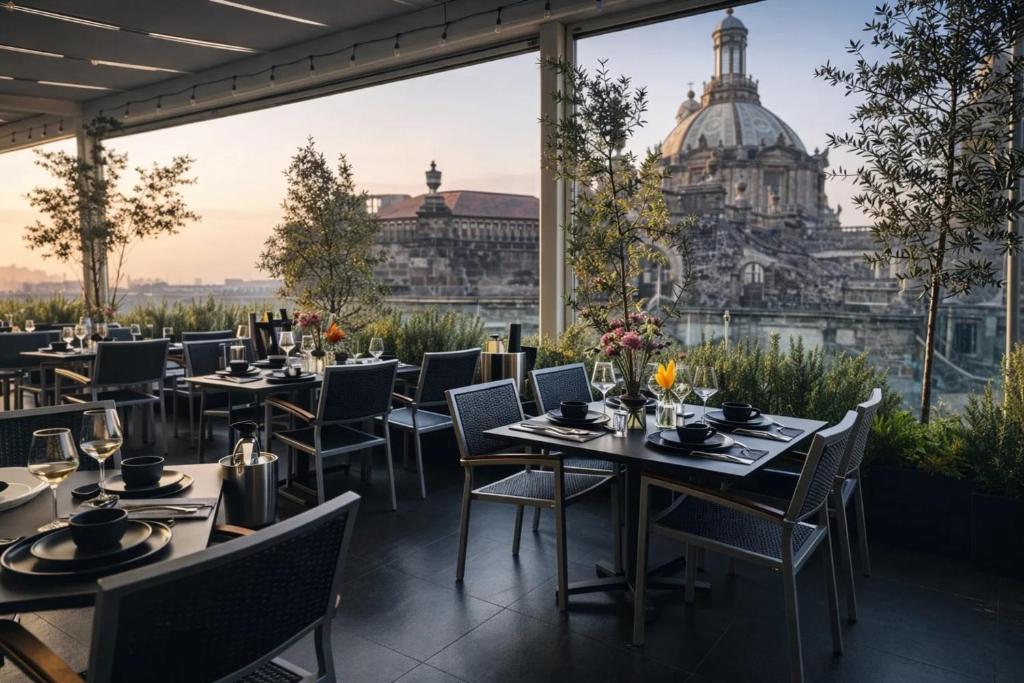 a restaurant with tables and chairs and a view of a building at Hotel Catedral in Mexico City
