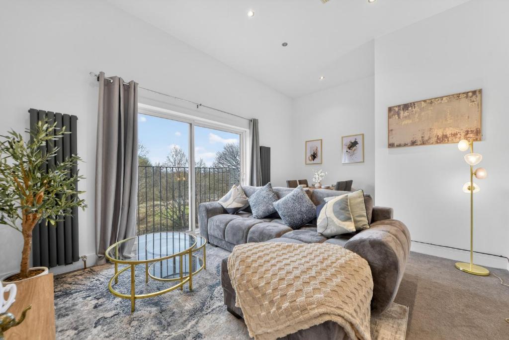 a living room with a couch and a table at The Oak Nest in Otford