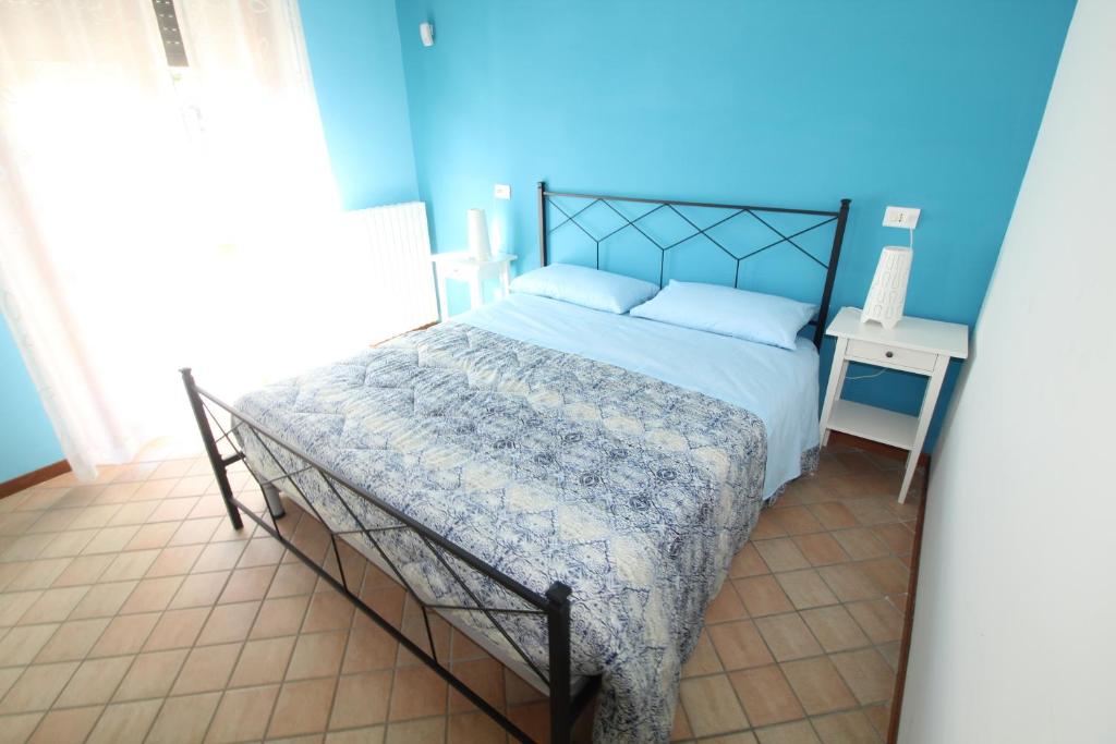Postel nebo postele na pokoji v ubytování Cala Chiara B&B