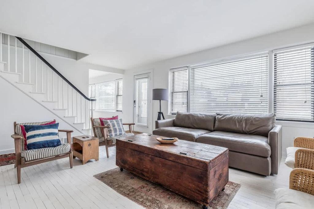 a living room with a couch and a coffee table at Hygge House in Harbert