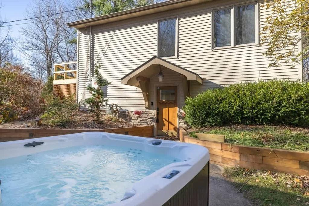 a bath tub in front of a house at The Coyote by Juniper Holiday + Home in Saugatuck