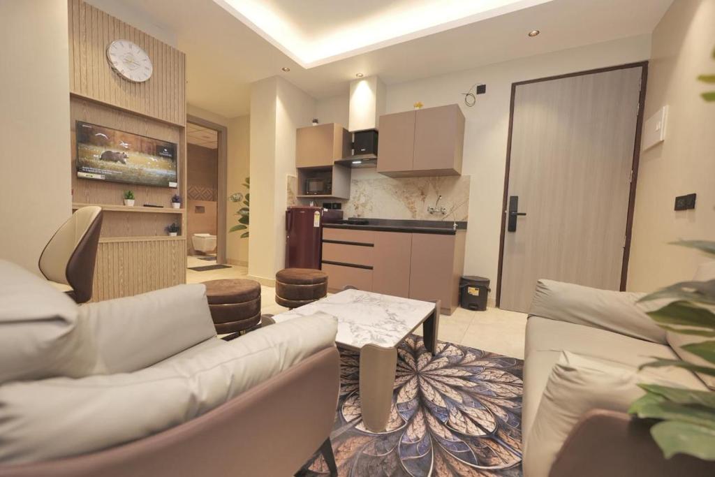 a living room with a couch and a table at Town Centers in Ghaziabad