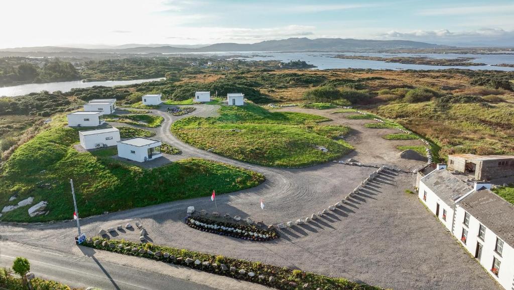 an aerial view of a building on a hill next to a river at Coastal Escape in Burtonport