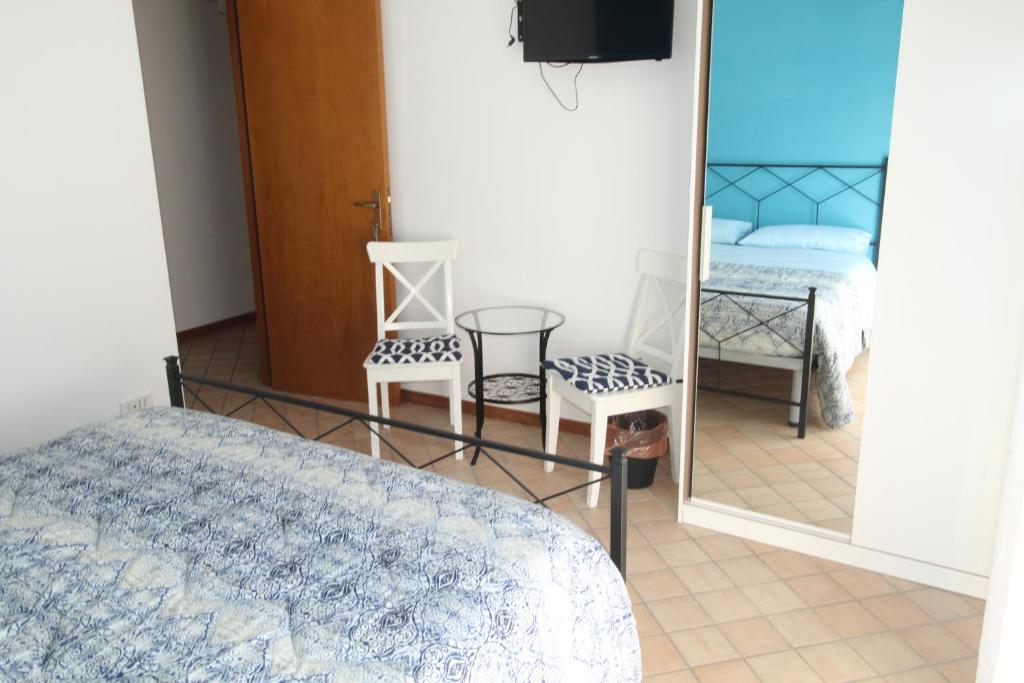 Postel nebo postele na pokoji v ubytování Cala Chiara B&B