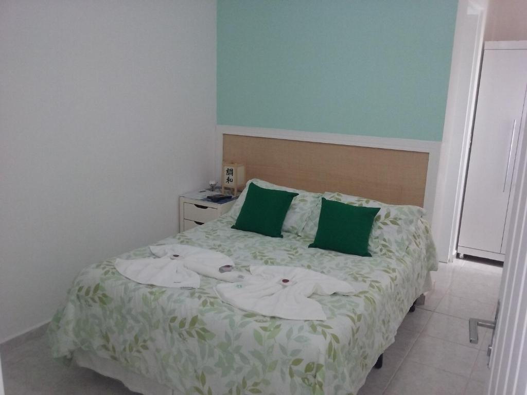 Cama ou camas em um quarto em Pousada Irashai