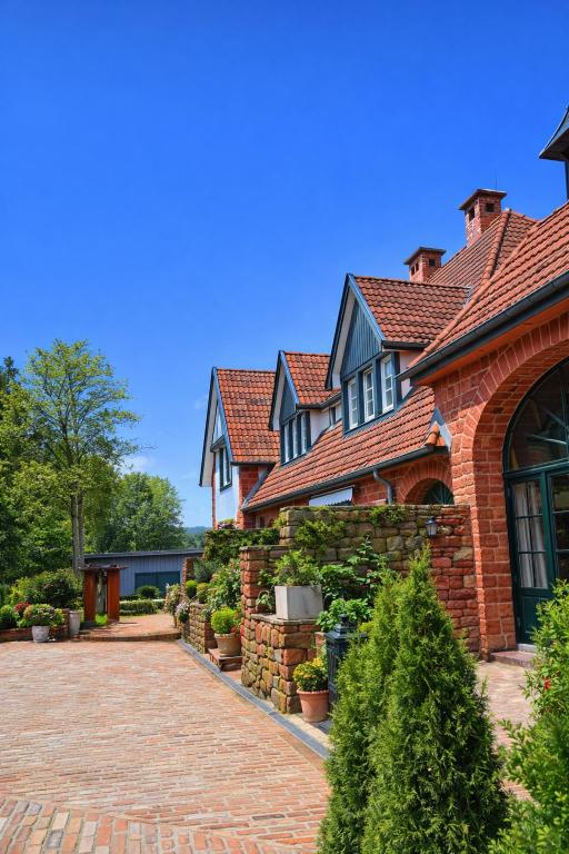 a brick house with a brick driveway at Romantik 2-6P in Mürlenbach