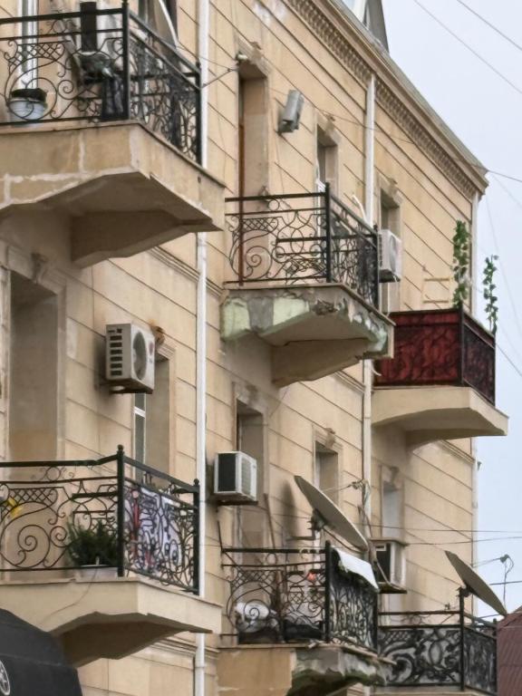 a building with balconies and air conditioners on it at The sweet room in Ganja