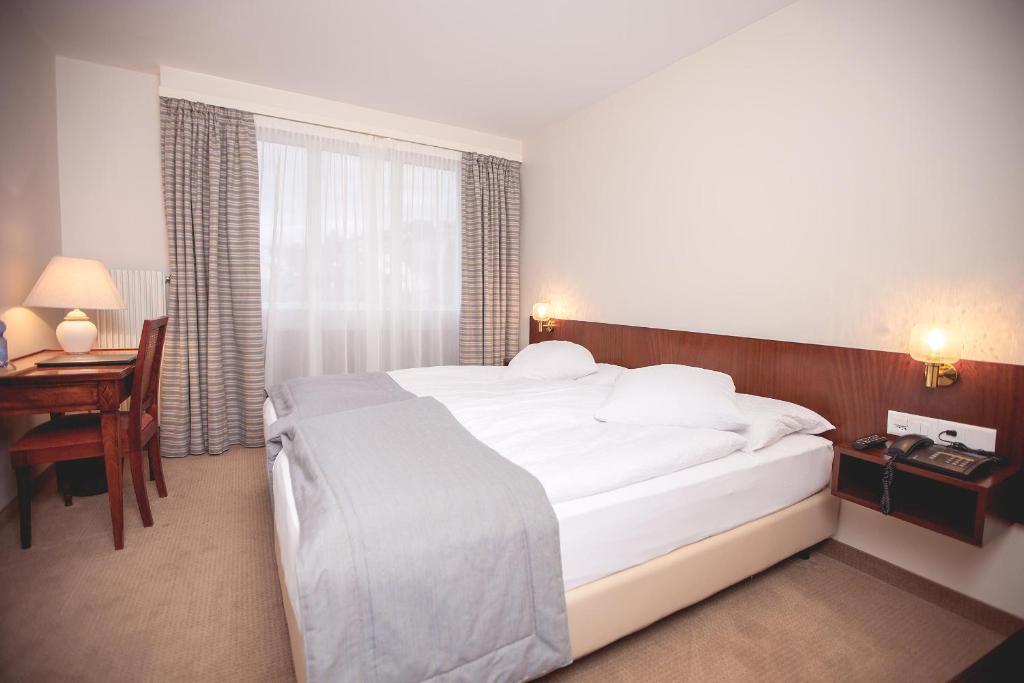 Letto o letti in una camera di Hôtel de Chailly