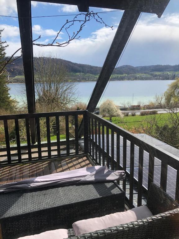 a porch with a view of a lake at Ferienwohnung Untersee in Öhningen