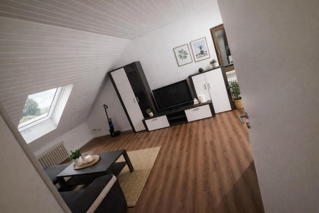a view of a living room from the attic at Appartment Okarben in Karben
