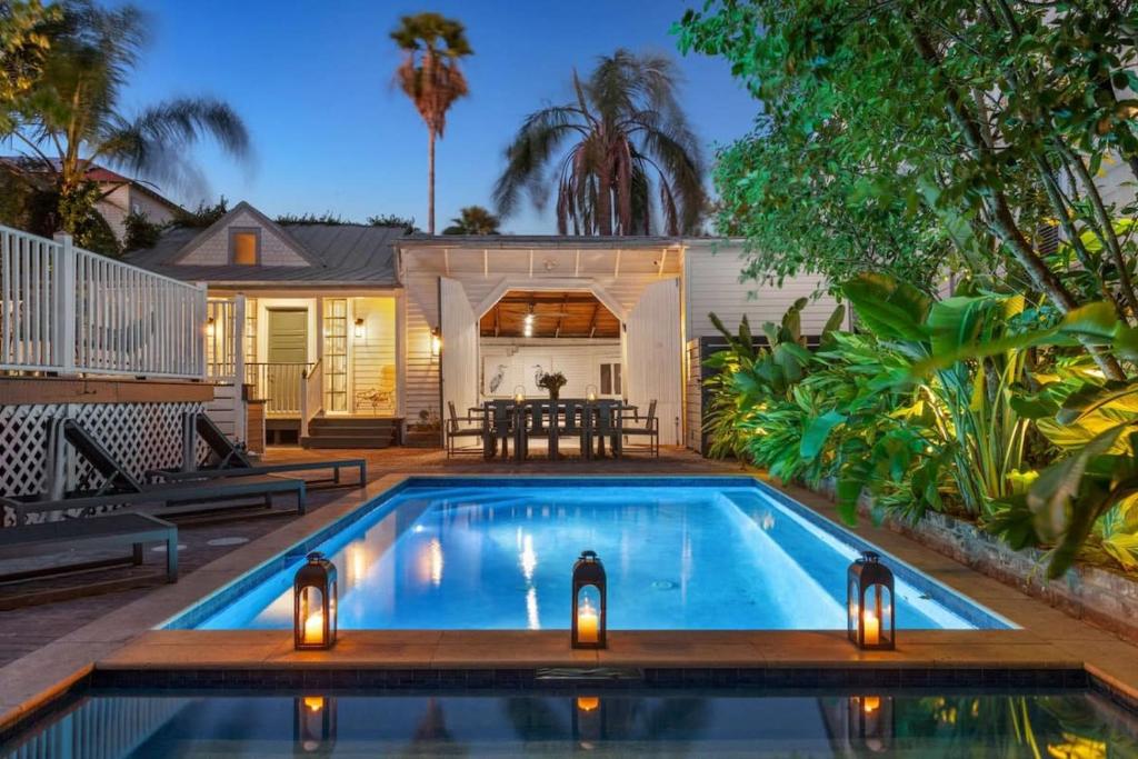 a swimming pool in the backyard of a house at Opulent Expansive Unit Heated Pool and Spa in New Orleans