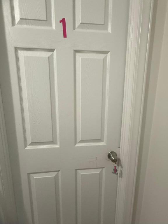 a red number on a white door at Palace priv april in Decatur