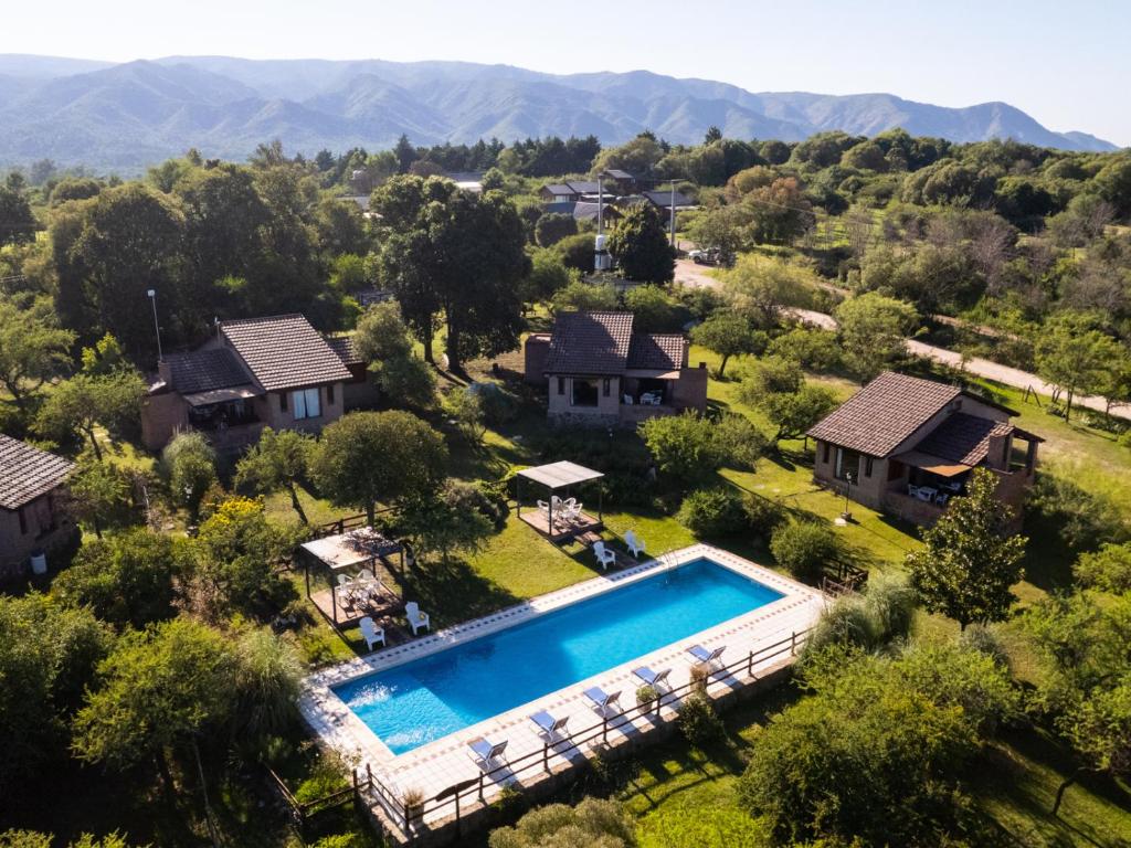 an aerial view of a house with a swimming pool at Sombra de Liebre Casas de Campo en Villa General Belgrano in Villa General Belgrano
