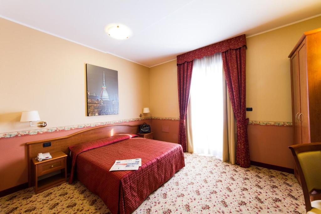 Postel nebo postele na pokoji v ubytování Vald Hotel