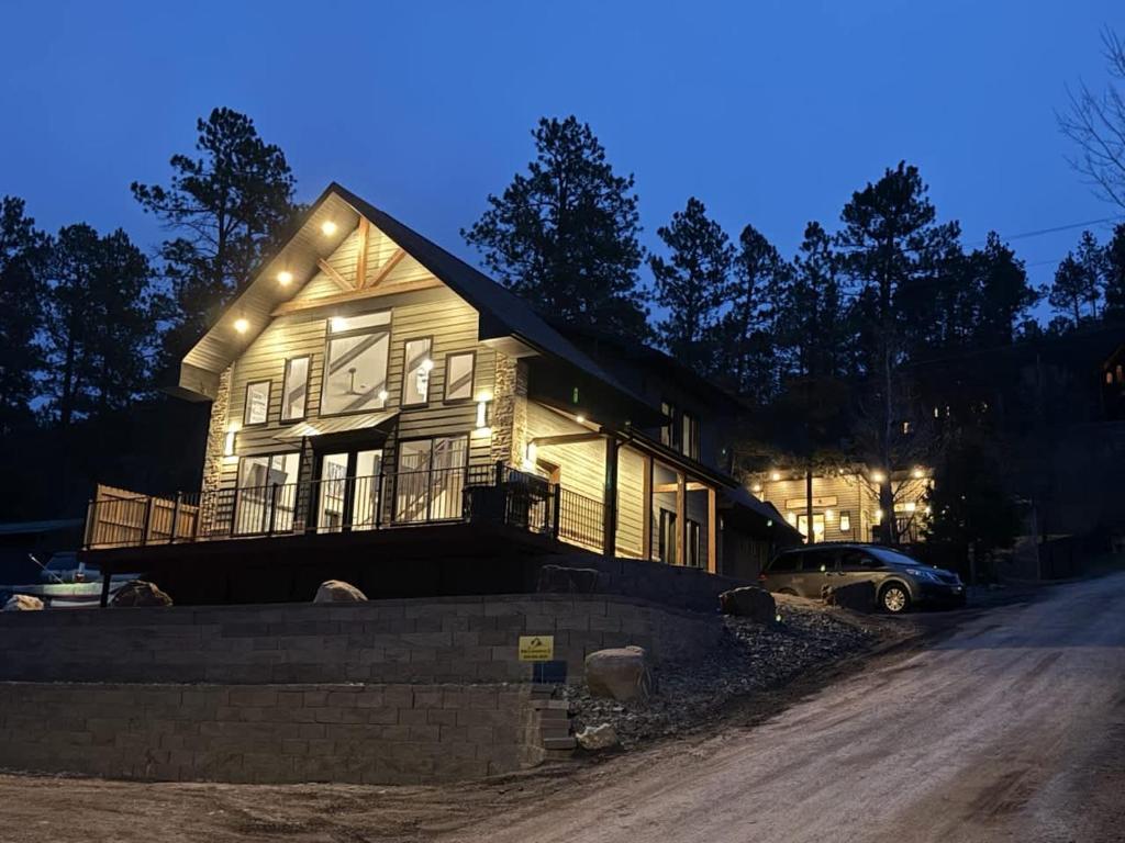 a house is lit up at night at The Gold Hill Chalet in Keystone